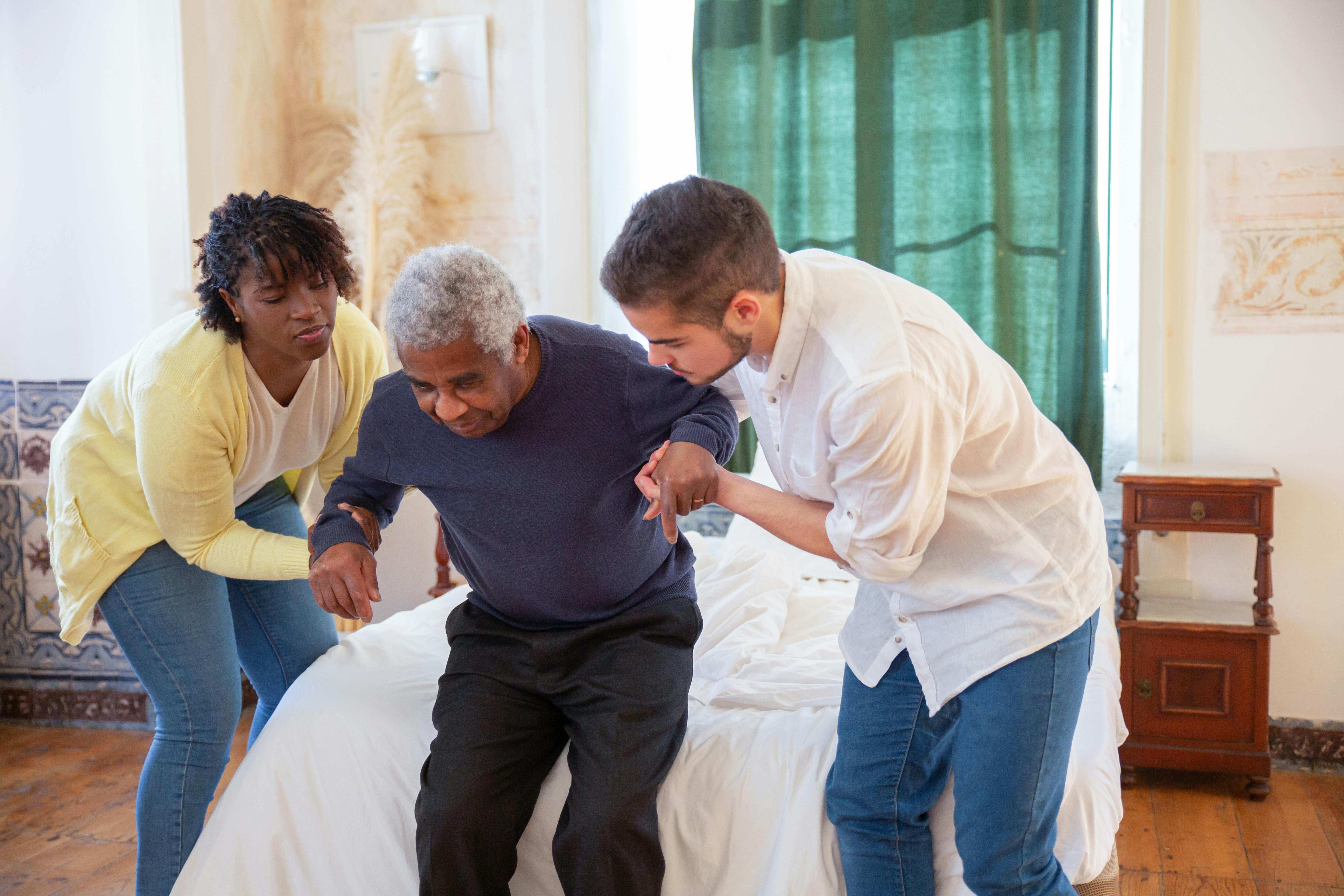 Caregiver assisting an older adult with transfers—an example of task-based justification